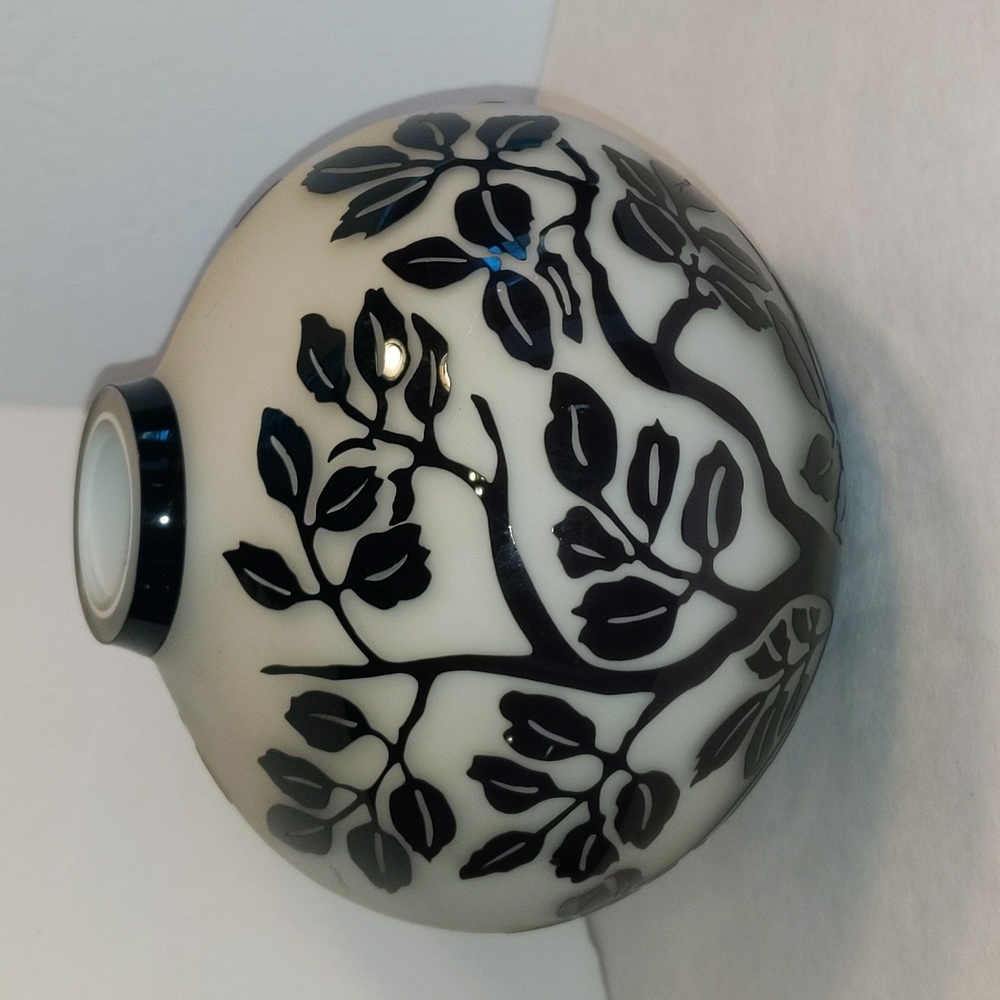 Glass vase frosted with black leaves